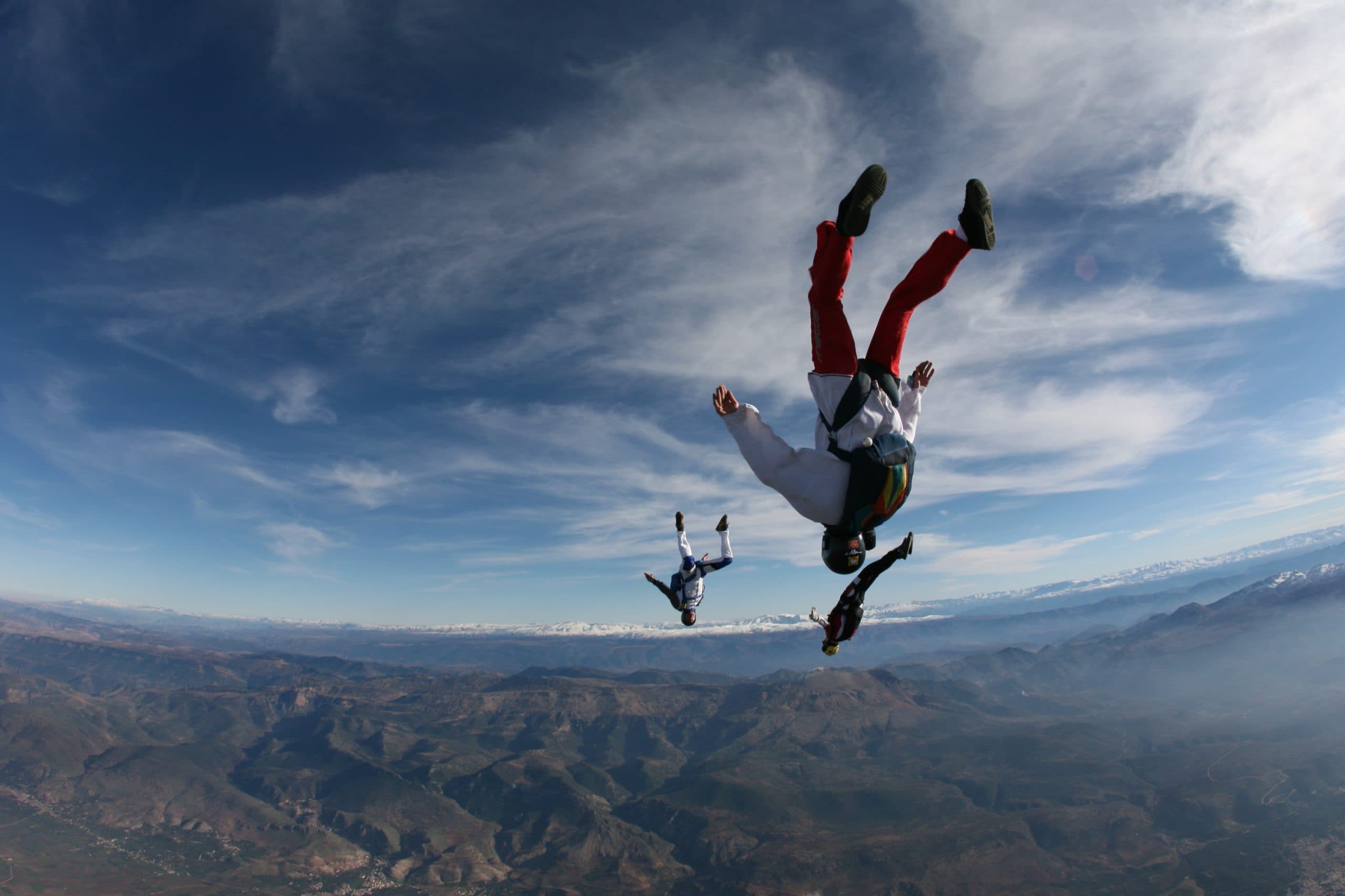 Skydivers in freefall above the Atlas Mountains near Beni Mellal
